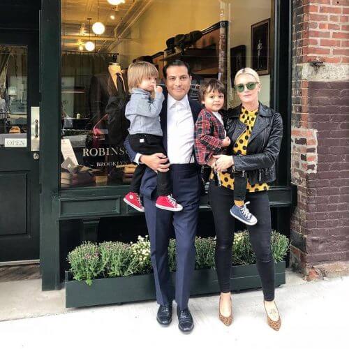 Robinson and his family posing in front of the shop