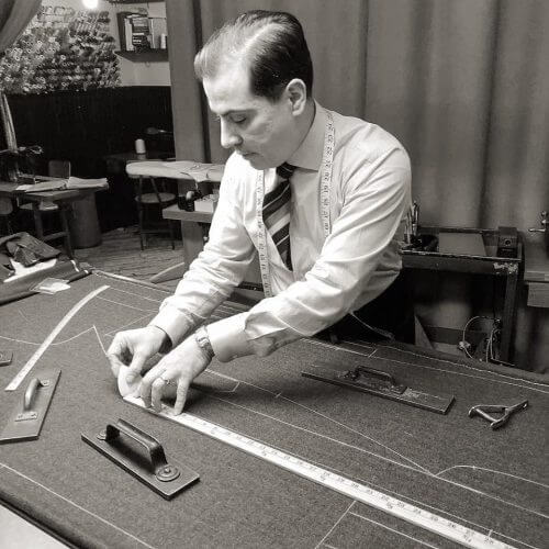 Robinson measuring new suit pattern