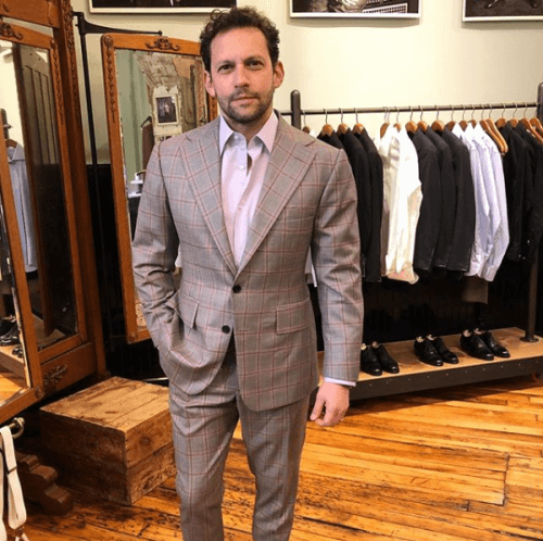 Model showing off a gray suit
