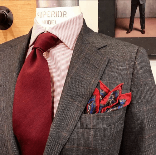 Charcoal suit jacket on display