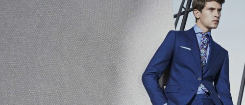 Model showing off a navy blue suit