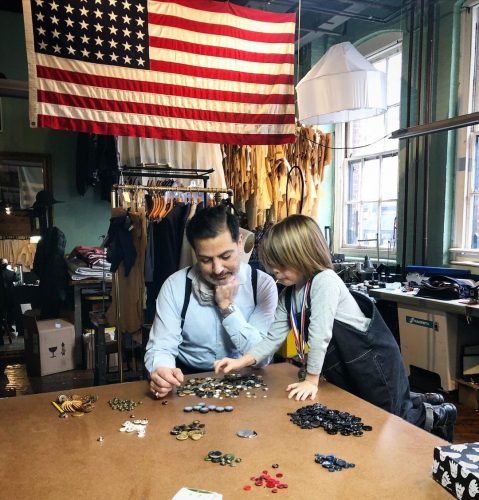 Robinson and young kid sorting buttons