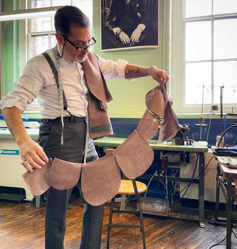 Robinson working on a suit