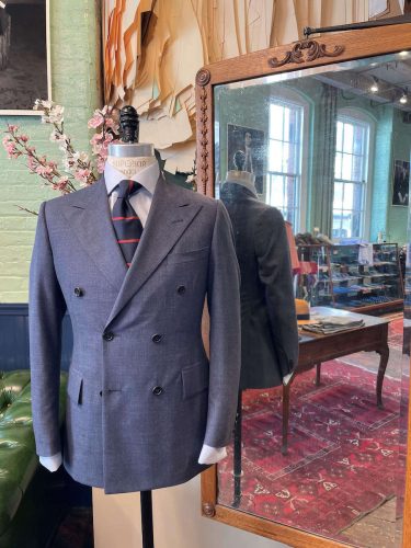 Gray suit jacket on display in the store