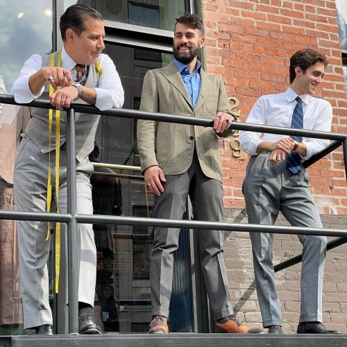 Robinson men standing outside of the store