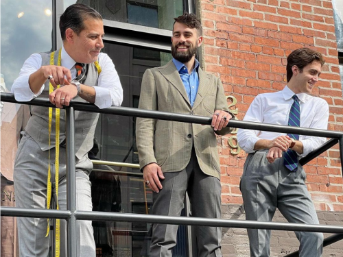 Robinson men standing outside of the store
