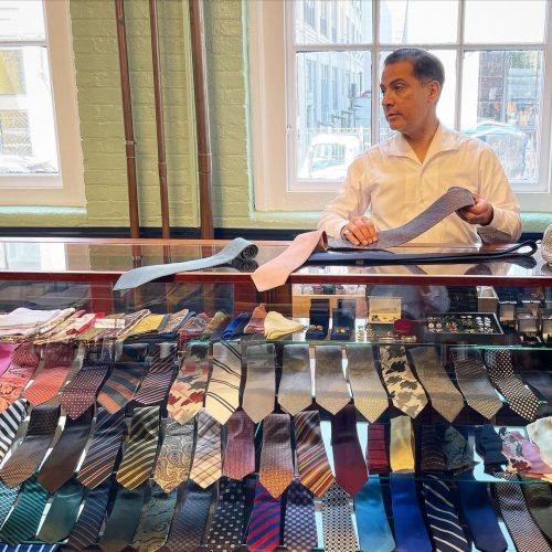 A display of many ties in varying colors and designs