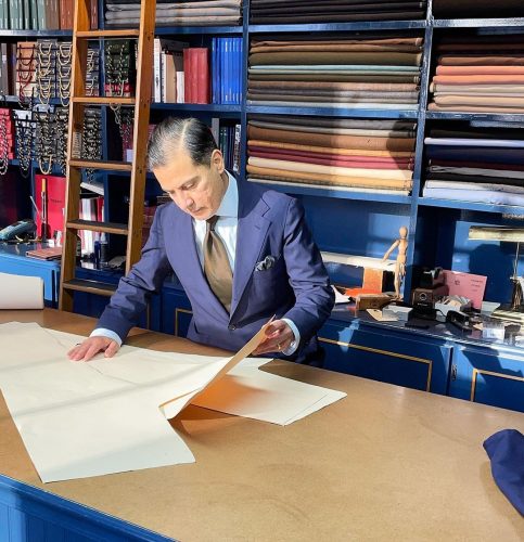 Robinson looking over a pattern