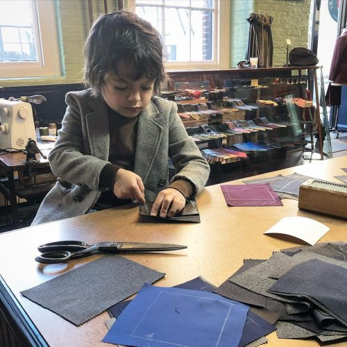 Young kid practicing their tailoring